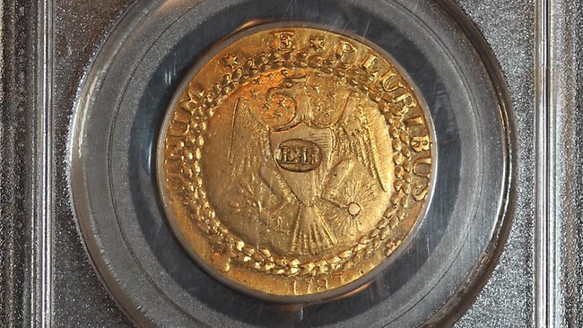 Золотая монета  Brasher Doubloon